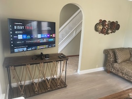 Deluxe House, Patio | Living area | Flat-screen TV