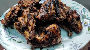 A plate of grilled chicken wings. - Brishti Bilash Guesthouse (Kamalganj)