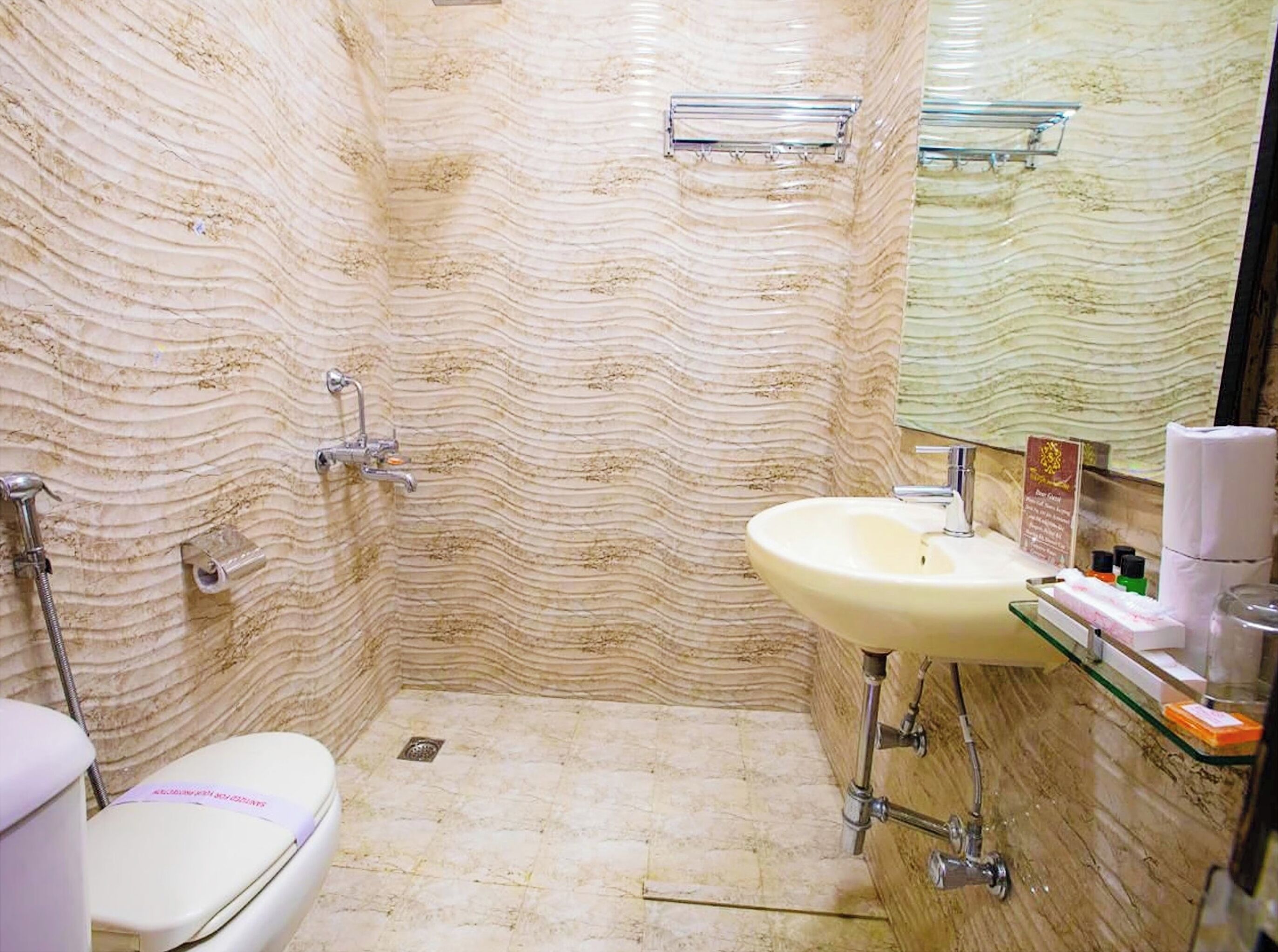 Shower, rainfall showerhead, slippers, towels