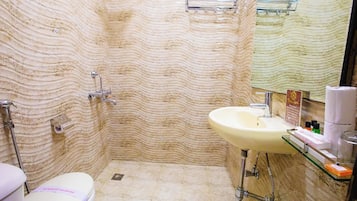 Shower, rainfall showerhead, slippers, towels