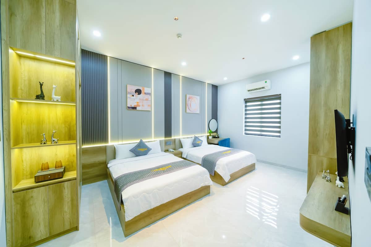 Deluxe Double or Twin Room, Multiple Beds, City View | In-room safe, individually decorated, individually furnished, desk