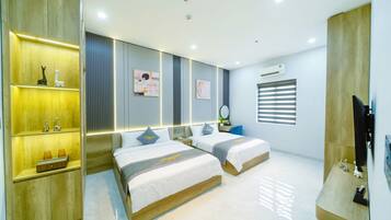 Deluxe Double or Twin Room, Multiple Beds, City View | In-room safe, individually decorated, individually furnished, desk