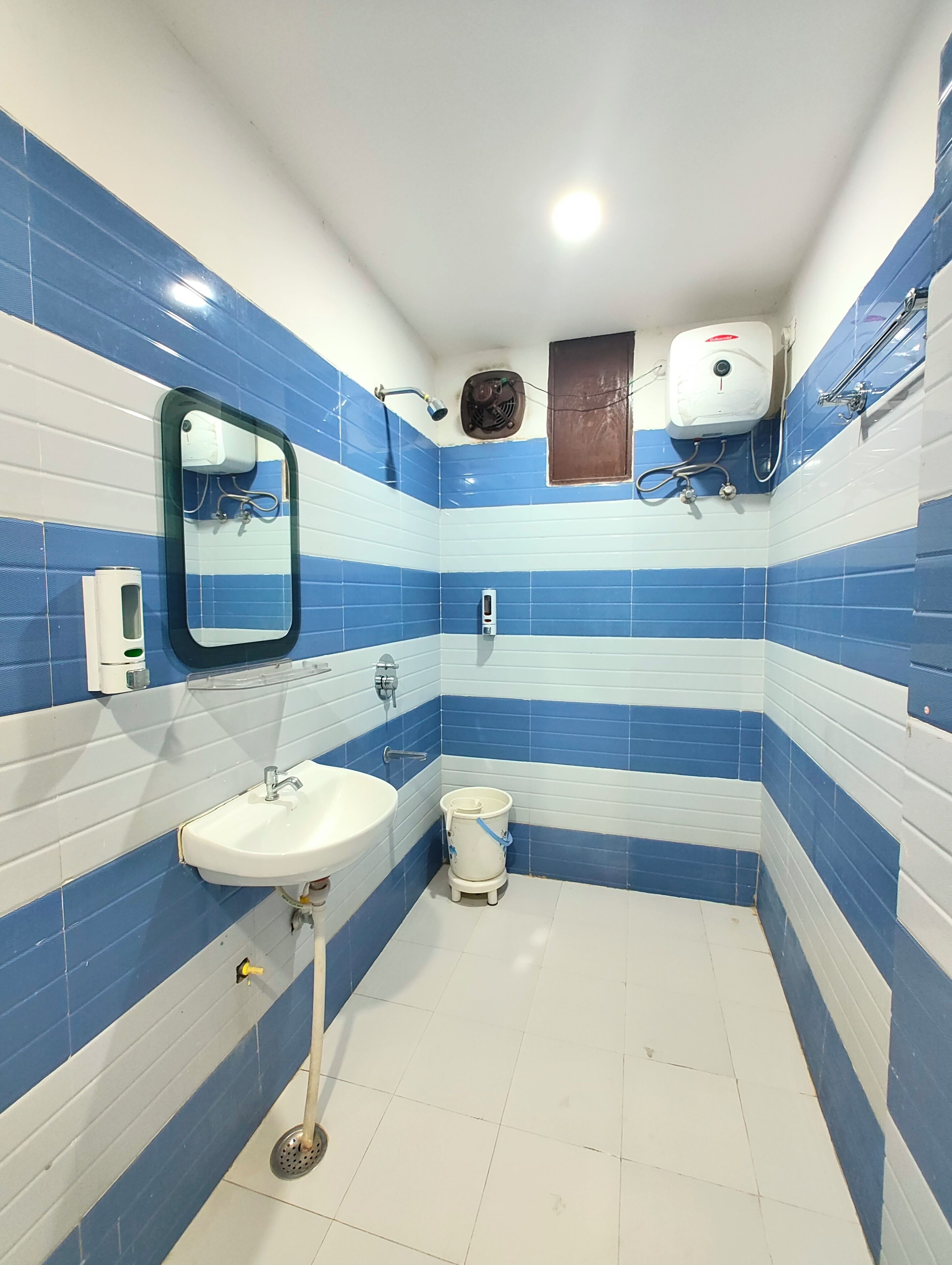 Shower, rainfall showerhead, slippers, towels