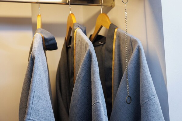 A clothing rack with several garments hanging. - Narinthra Heritage (Chiang Mai)