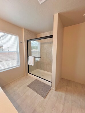 Shower, hair dryer, towels, soap