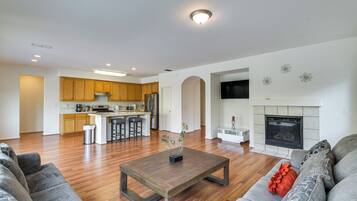 TV, fireplace, books