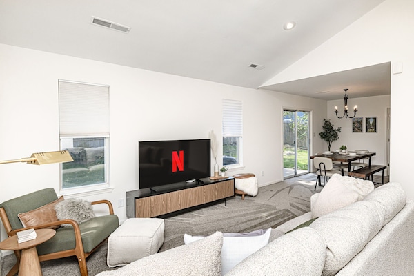 Warning: our living room may cause excessive lounging. Cushy couches, cozy vibes, and a space that feels like vacation the second you walk in.