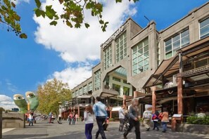 A commercial building with a large glass facade and signage for 'Southgate.' - Cozy & Chic Apt Near Crown Casino & Southgate Mall (Southbank)
