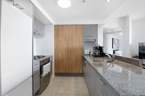 Fridge, microwave, oven, stovetop - Arcade in the Sky - Views, Games & Vibes (Brisbane)