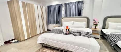 A modern bedroom with two beds, a large window with curtains, and a ceiling with blue lighting.