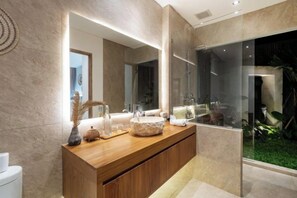 A modern bathroom with a wooden vanity, large mirror, and a glass shower enclosure. - Villa Kyson Art Ubud by BaliSuperHost (Bali)