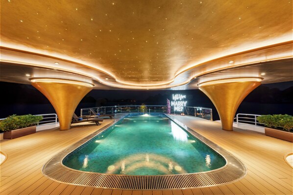 A pool area with a central pool, deck railings, and a 'MARRY ME?' sign. - Sea Stars Premium Cruises (Ha Long)