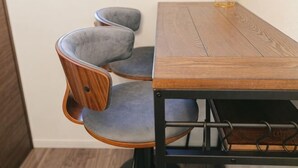 A dining table with chairs, a lamp, and a framed picture on the wall. - QiQi House Serenity~Private Near Asakusa & Skytree (Tokyo)