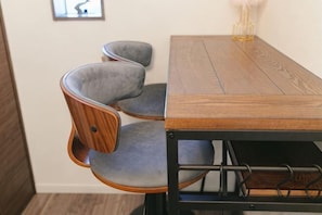 A dining table with chairs, a lamp, and a framed picture on the wall. - QiQi House Serenity~Private Near Asakusa & Skytree (Tokyo)