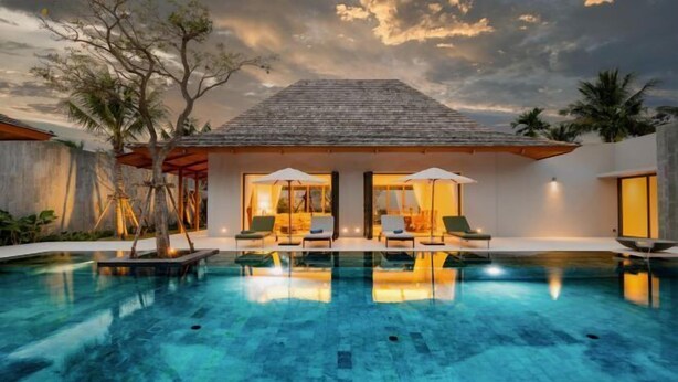 A modern villa with a swimming pool, outdoor seating, and a view of the sky. - Anchan Tropicana Pool Villa near Laguna & Beach Phuket Warm Plus (Phuket)