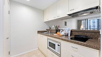 Microwave, stovetop, electric kettle, cookware/dishes/utensils