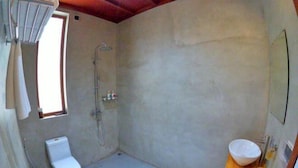 A bathroom with a toilet, shower, and sink. - Blue Coral Vashafaru Maldives (Vashafaru)