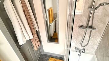 Shower, hair dryer, towels, soap