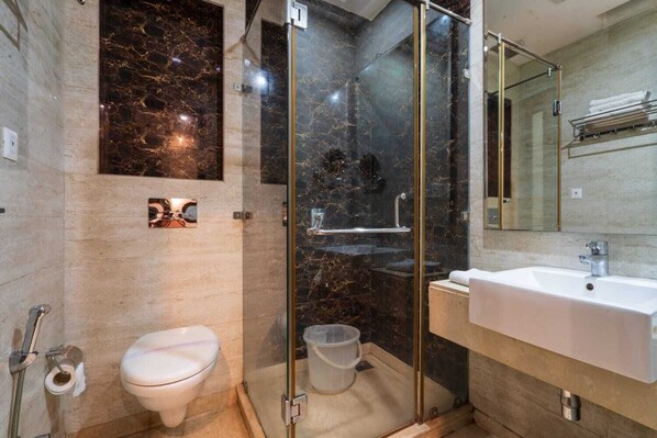 Deluxe Room, City View | Bathroom | Shower, free toiletries, hair dryer, slippers - Grand FFOUR near Nehru Place, Delhi (New Delhi)
