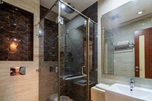 Deluxe Room, City View | Bathroom | Shower, free toiletries, hair dryer, slippers - Grand FFOUR near Nehru Place, Delhi (New Delhi)