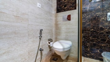 Deluxe Room, City View | Bathroom | Shower, slippers, towels, soap