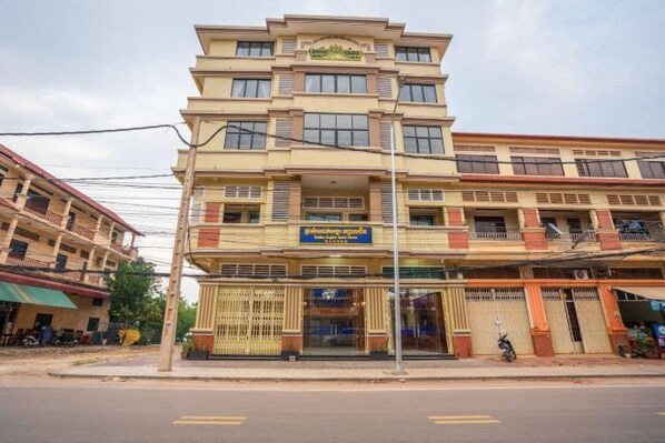 A multi-story building with a sign indicating it is a hotel. - Angkor Golden Guest House (Siem Reap)