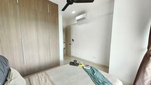 A bedroom with a bed, a wardrobe, a ceiling fan, and an air conditioning unit. - 3806 Macrolink 6pax Cozy Legoland Netflix BySTAY (Iskandar Puteri)