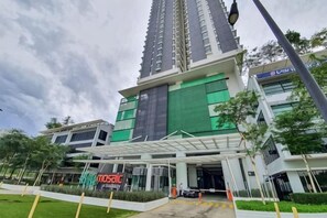 A modern building with a prominent entrance, a covered walkway, and a sign for 'Mosaic.' - Mosaic Midvalley Southkey (Johor Bahru)