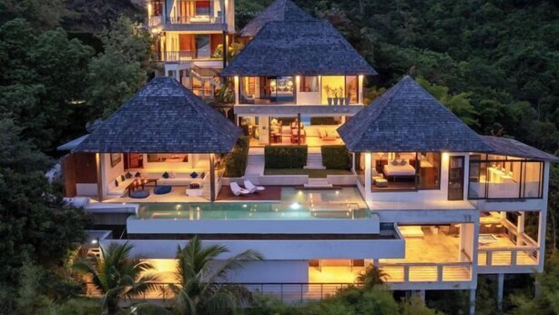 A modern multi-story house with a swimming pool, surrounded by lush greenery. - Jasmine Waterslide 5BR Pool Villa (Koh Samui)