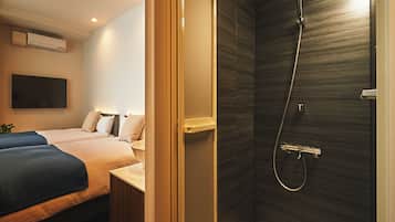 Economy Twin Room | Bathroom | Shower, hair dryer, slippers, electronic bidet