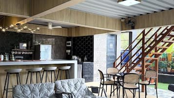 Comfort House, 1 Bedroom, Private Pool, Garden Area | Living room | 58-inch Smart TV with digital channels, books