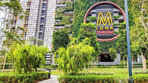 A modern building with a circular logo featuring the letters 'M' and 'UNA' and the name 'MainSing'. - Sunset Lake View at M-Luna Kepong by HCK (Kuala Lumpur)