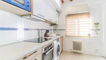 Oven, stovetop, toaster, dining tables