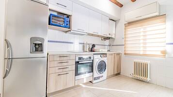 Oven, stovetop, toaster, dining tables