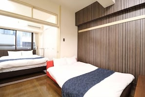 A hotel room with two beds, a large window, and a wooden panel wall. - Amistá.You (Osaka)
