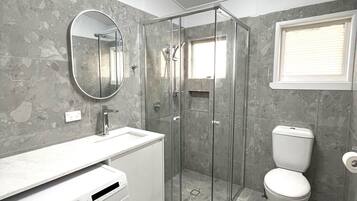 Shower, hair dryer, towels, toilet paper