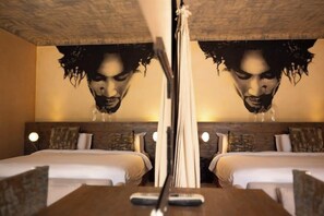 A hotel room with two beds, a large mirror, and a wall mural. - The Source Hotel Music & Spa (Marrakech)