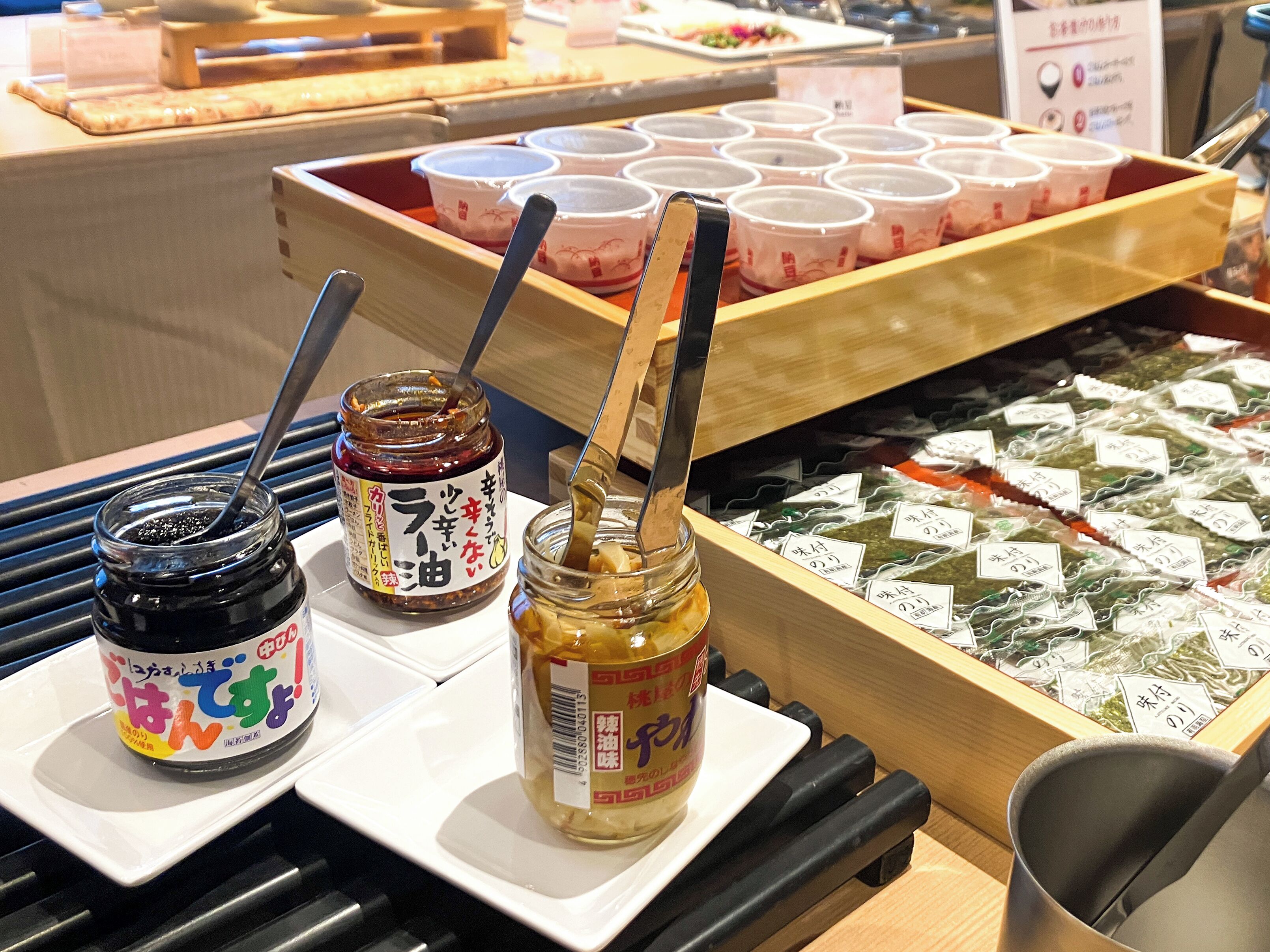 A display of condiments and sauces in a restaurant setting.