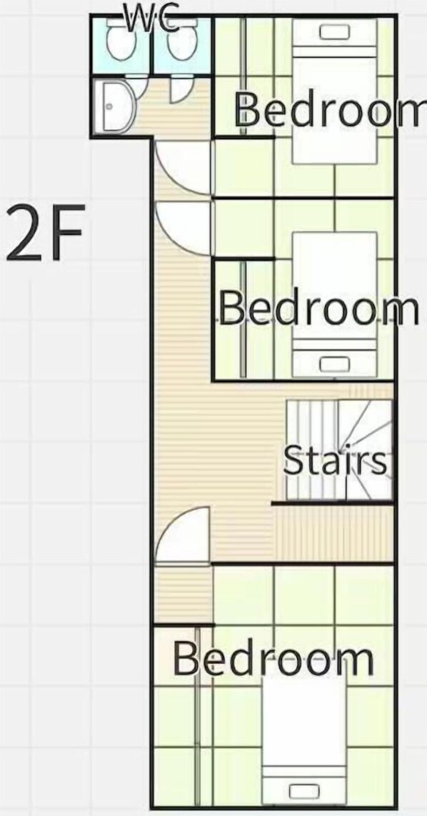 A floor plan with two bedrooms, a bathroom, and a staircase. - Yuzawa Onsen Lodge House B (Minamiuonuma)