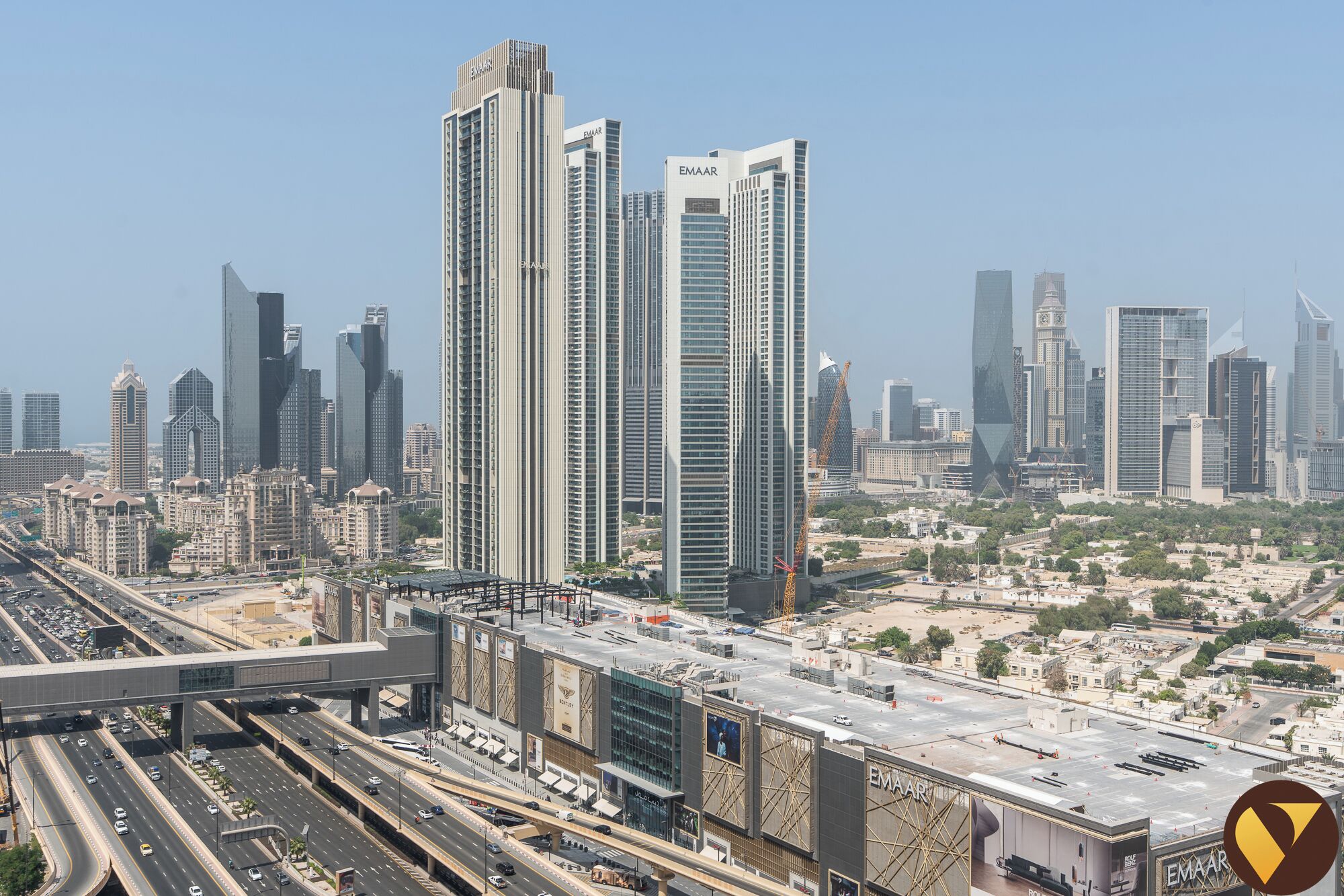 A high-rise building with multiple floors, likely a hotel or office building, in an urban setting with other tall buildings in the background.