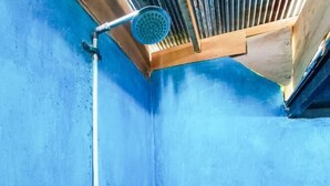 A blue-painted room with a shower and a wooden ceiling structure. - Rejeng Bungalow near Gangga Waterfall Lombok (Genggelang)
