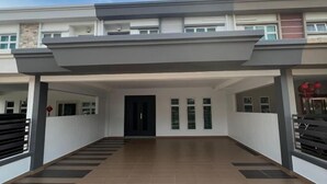 A modern building with a covered entrance, multiple windows, and a tiled floor. - 5 min to AeonBig , Old Street, BP Mall & D Garden (Simpang Kanan)