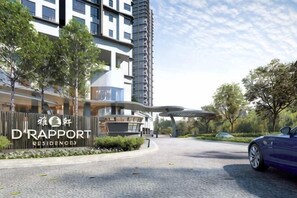 Een modern gebouw met een bord waarop 'D'Rapport Residences' staat.