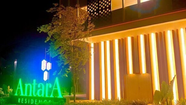 A modern building with vertical light panels and a sign reading "AntarA RESIDENCE". - FZ Homestay @ Putrajaya P5 : Luxury & scenic stay (Putrajaya)