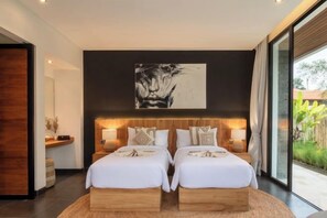 A modern bedroom with a large bed, bedside tables, and a view of the outdoors. - Villa Purnama Ubud by BaliSuperHost (Bali)