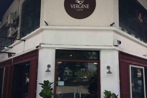 The exterior of Vergine Cafe with a prominent sign above the entrance. - Beautiful Suria Kipark Damansara 3R2B Apartment (Batu)