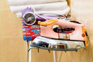 An ironing board with an iron and a hairdryer. - Seremban-Spacious-Lovely-Home-Bkt Chedang-S2-10R4B (Seremban)
