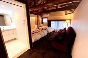A bedroom with a large bed, a bedside table, a mirror, and a window with curtains. - Ranjatai Premium (Nara)