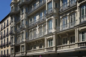 A multi-story building with balconies and large windows. - Heart of Madrid III Museums Theatres Sights (Madrid)