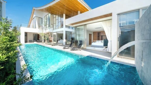 A modern house with a swimming pool, large windows, and a wooden ceiling. - Trinity Villa 5 Bedroom & 20 Meter Pool Luxury Villa near Bangtao Beach (Phuket)